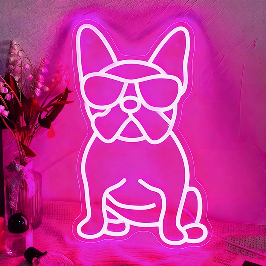 Neon light shaped like a dog with sunglasses on a pink background