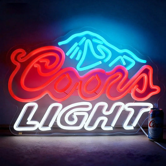 Neon Coors Light sign with mountain graphic on a dark background