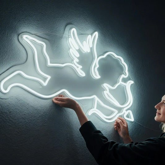 Neon white light of a cupid on a dark background