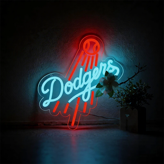 Neon sign with 'Dodgers' logo on a textured wall.