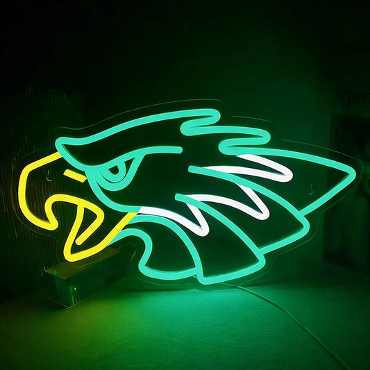 Neon sign of an eagle design on a dark background