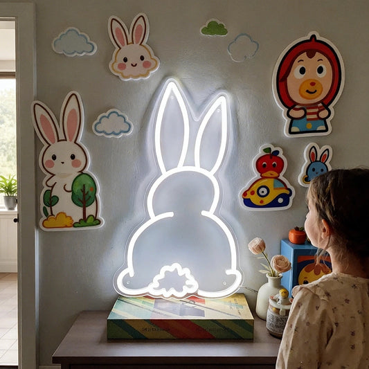 A cute little girl watching at a glowing easter bunny neon light sign in a room.