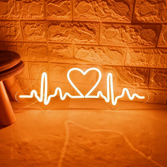 Warm white neon sign shaped like a heart with heartbeat lines on a textured wall.