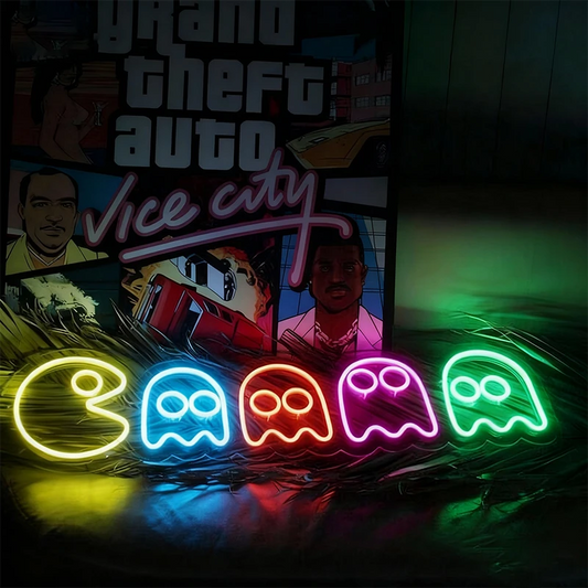 Neon signs with 'Grand Theft Auto Vice City' design and Pac-Man ghosts on a dark background.