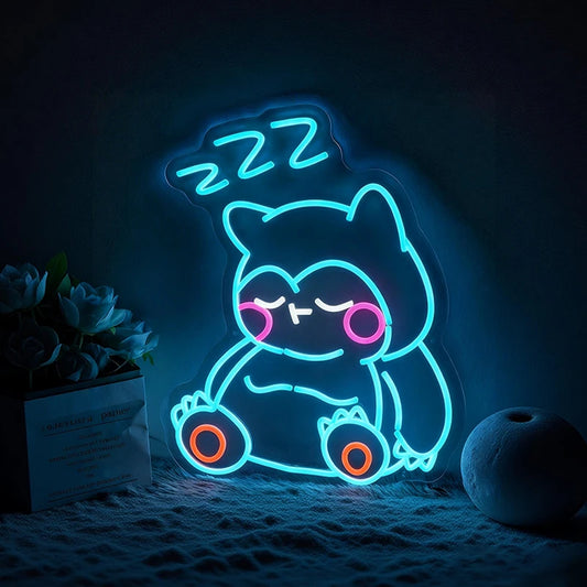 Neon light shaped like a snorlax with 'Zzz' text on a dark background