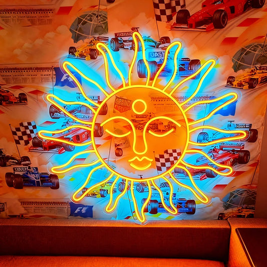Neon sun-shaped sign with racing car graphics in the background
