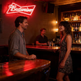 Budweiser Neon Sign with two couple in the bar
