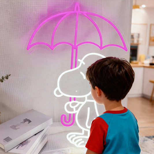 Child looking at a neon sign of a cartoon character with an umbrella on a wall.