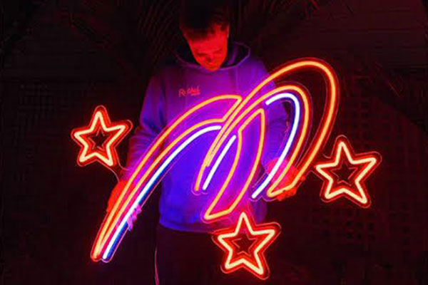 Holding Neon Sign