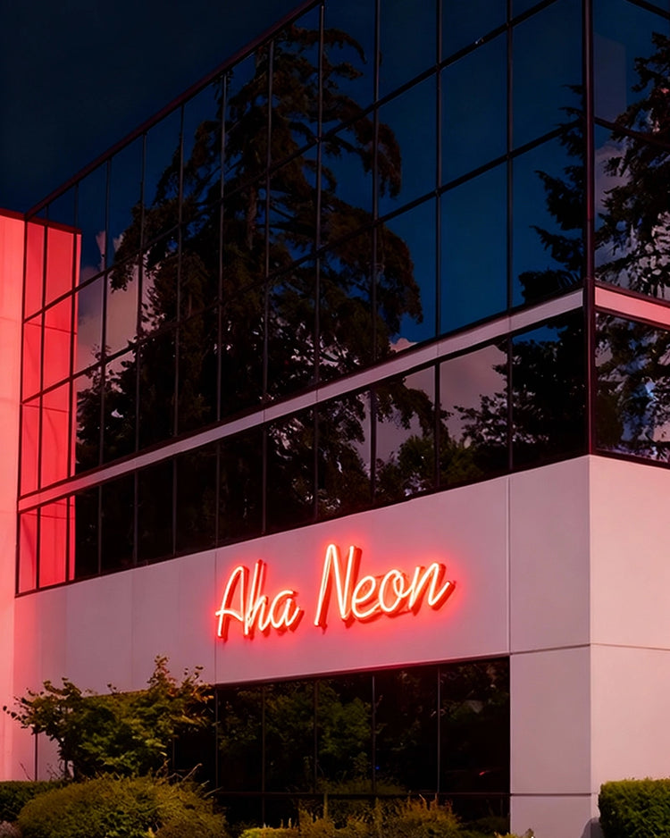 Neon sign on a building exterior with 'Aha Neon' branding.