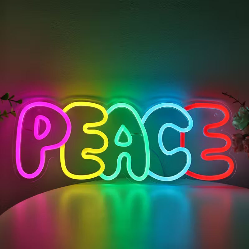 Neon sign spelling 'PEACE' with colorful letters on a dark background