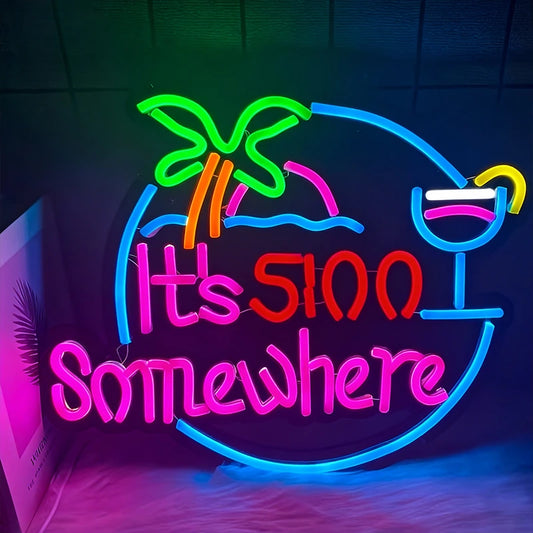 Neon sign with palm tree, cocktail, and text 'It's 500 Somewhere' on a dark background