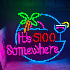 Neon sign with palm tree, cocktail, and text 'It's 500 Somewhere' on a dark background