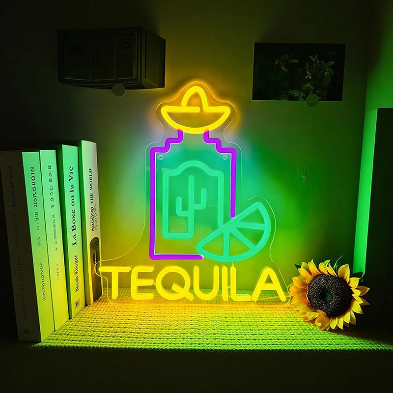 Neon sign with tequila design on a shelf with books and a sunflower.