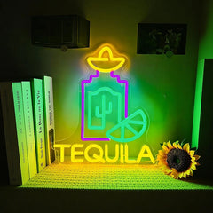 Neon sign with tequila design on a shelf with books and a sunflower.