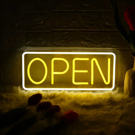 Neon 'OPEN' sign glowing in a dark setting