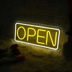 Neon 'OPEN' sign glowing in the dark
