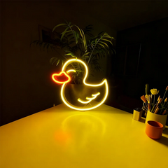 Neon duck-shaped light on a dark background