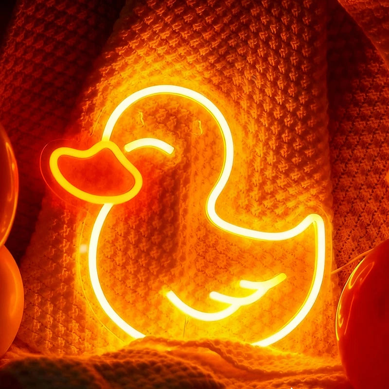 Neon duck sign on a textured orange background