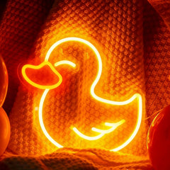 Neon duck sign on a textured orange background