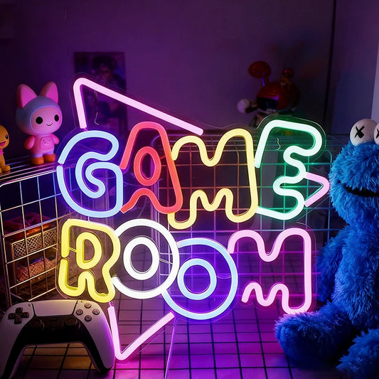 Neon sign that reads 'GAME ROOM' on a dark background