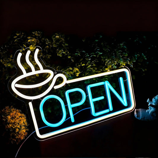 Neon sign with coffee cup and 'OPEN' text on a dark background