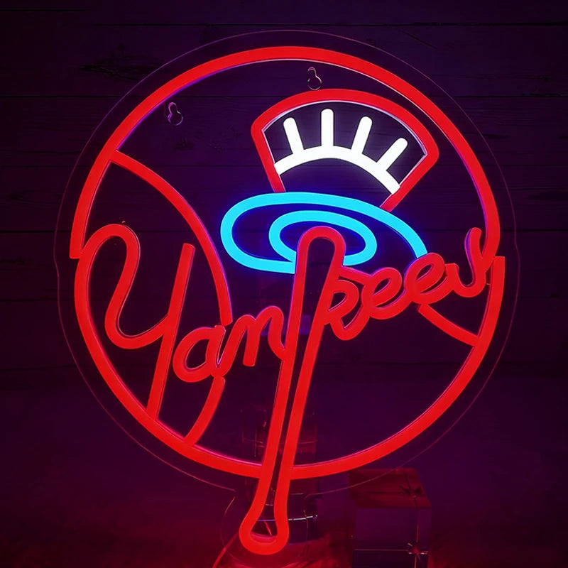 Neon sign with 'Yankees' logo on a dark background