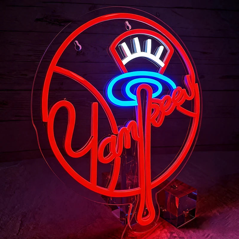 Neon sign with 'Yankee' logo on a wooden background