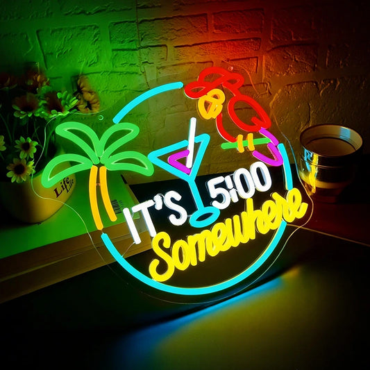 Neon sign with cocktail, palm tree, and text 'It's 5:00 Somewhere' on a brick wall background.