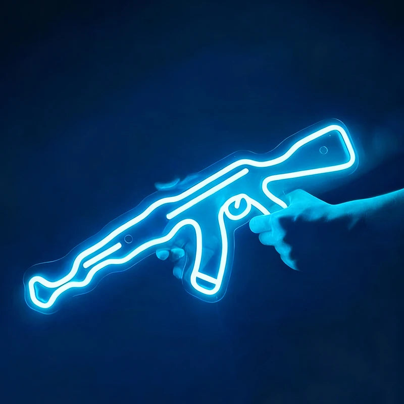 Neon blue outline of a AK 47 held by a hand against a dark background