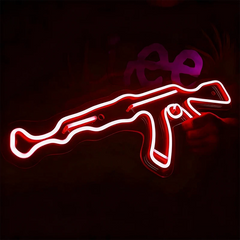 Neon light shaped like a AK 47 on a dark background