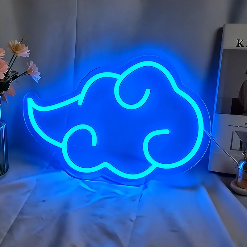 Neon cloud-shaped sign glowing blue on a white surface with a blurred background