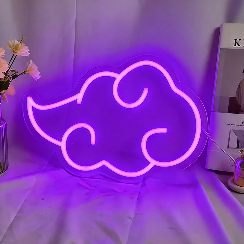 Neon cloud-shaped sign emitting a purple glow on a white surface.