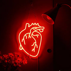 Neon sign of a heart shape on a dark background