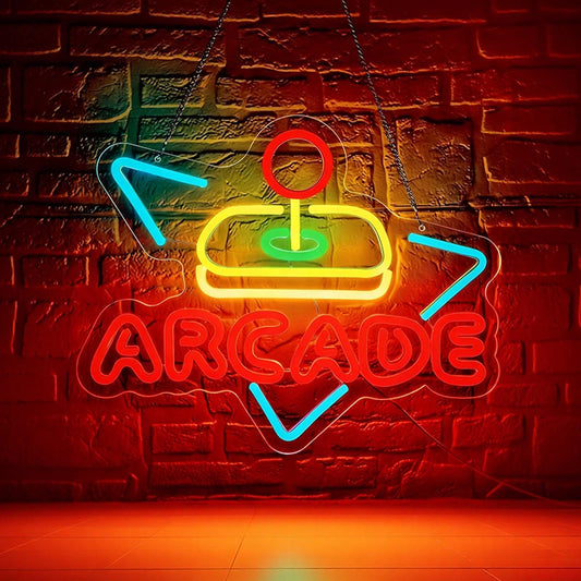 A colorful neon 'Arcade' sign hanging in front of a brick wall.