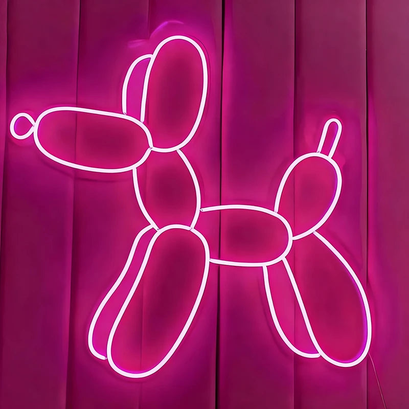 Neon hot pink balloon dog sculpture on a pink background