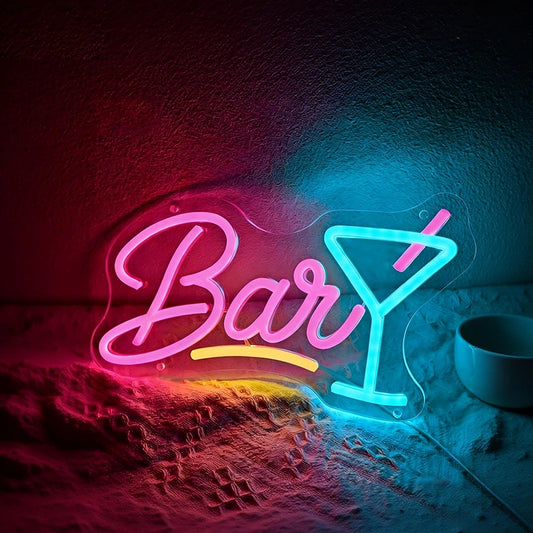 Neon sign with 'Bar' and a martini glass on a textured surface.