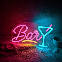 Neon sign with 'Bar' and a martini glass on a textured surface.
