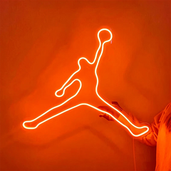 Neon outline of a jumping figure on an orange background