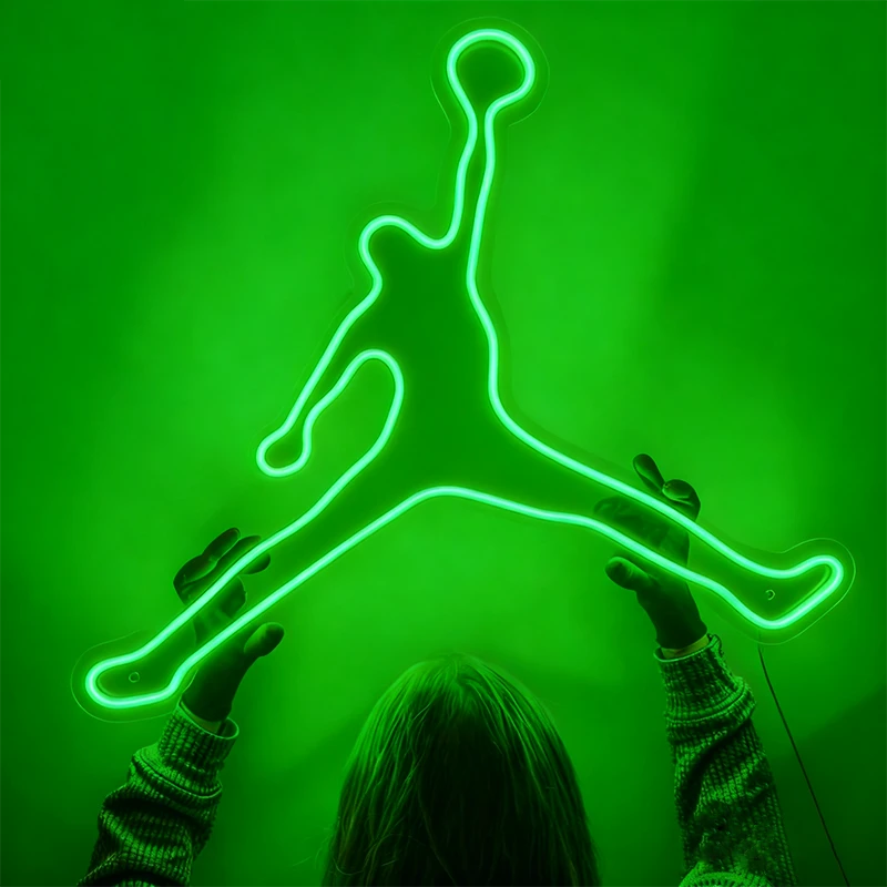 Neon green outline of a famous athletic shoe brand logo on a solid green background