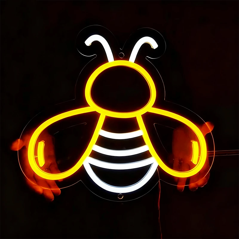 Neon sign shaped like a bee on a black background