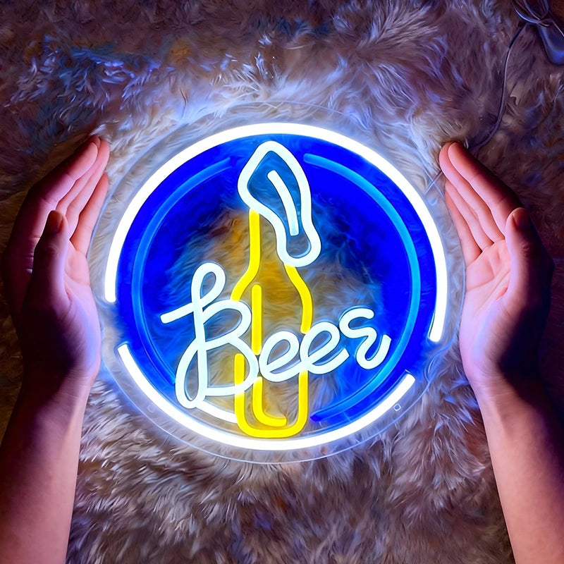 Neon sign with 'Beers' and a bottle shape, held by two hands on a textured surface.