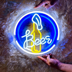 Neon sign with 'Beer' and a bottle shape on a fluffy surface