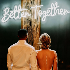 Two people standing together with 'Better Together' text above them.
