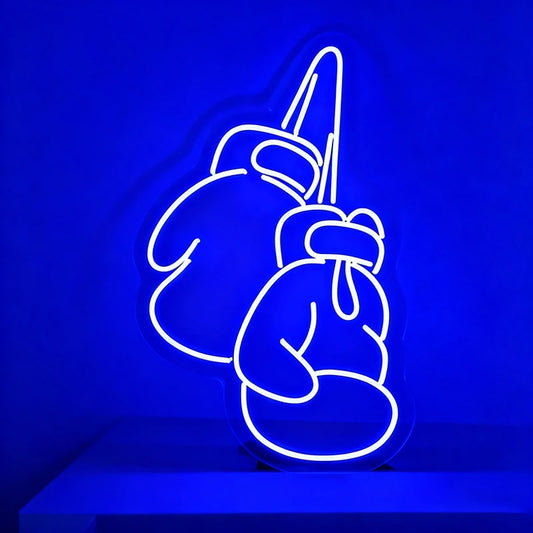 Neon sign of boxing gloves on a blue background