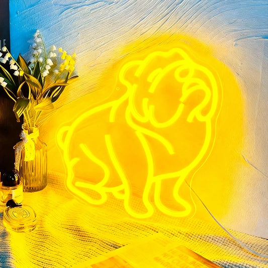 Neon bulldog light on a textured surface with flowers and perfume bottle in the background