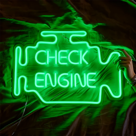 Green neon sign shaped like a car engine with 'Check Engine' text on a fabric background.