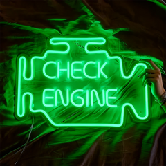 Green neon sign shaped like a car engine with 'Check Engine' text on a fabric background.