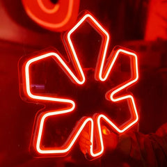 Neon red chestnut leaf on a dark background