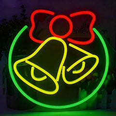 A neon sign featuring a red bow, lemon yellow bell, and green circular outline on a dark background.